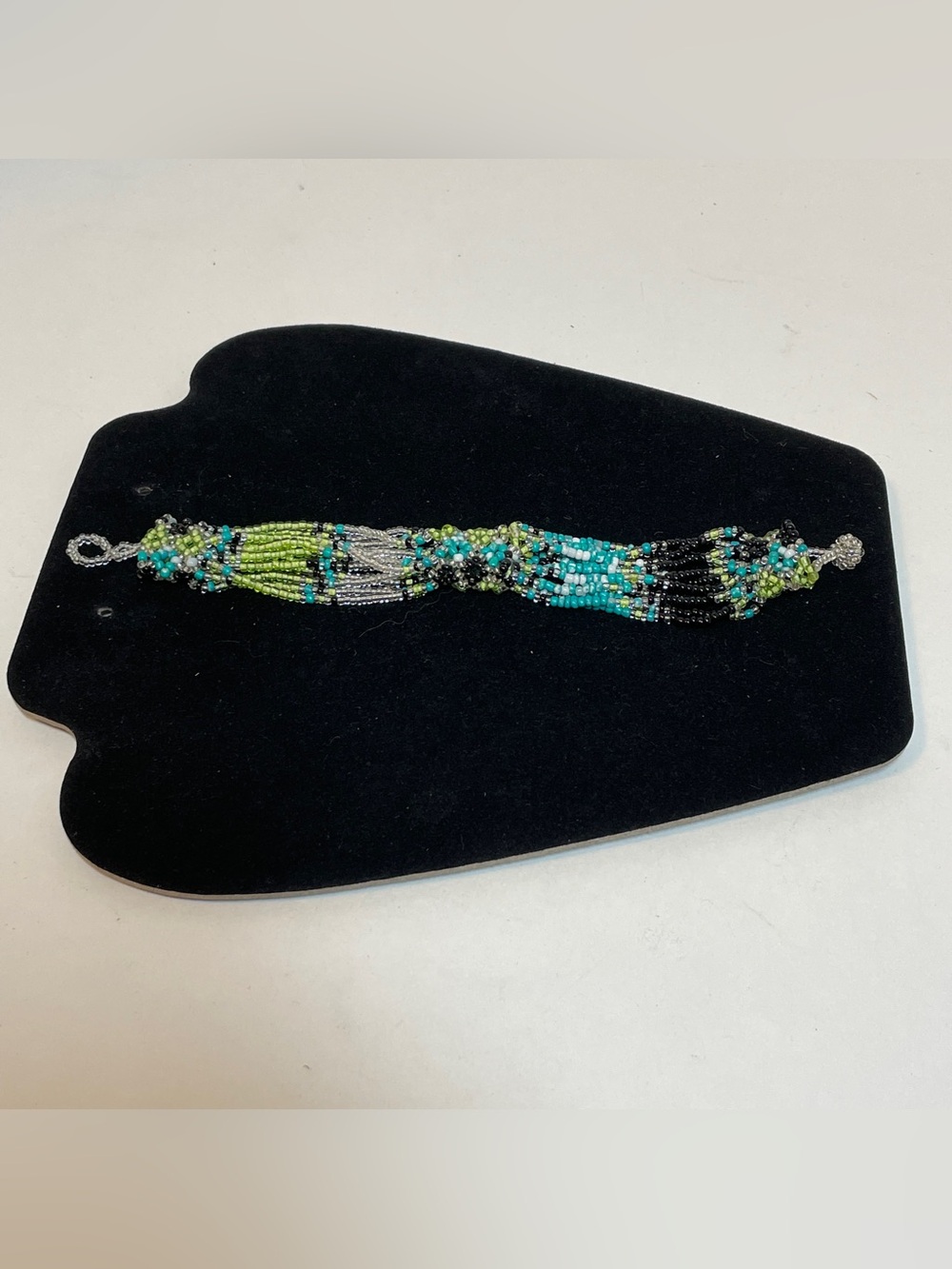 Handmade seed bead Conical/tube 12 strand lime, teal, black, clear bracelet, 7”